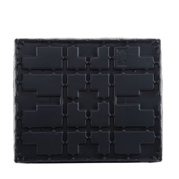 A black plastic pallet with a pattern on it.
