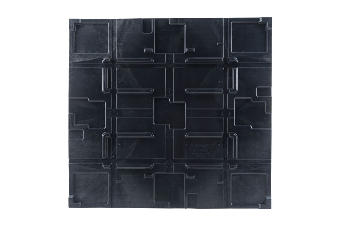 An image of a black plastic pallet with squares.