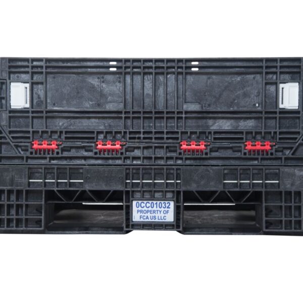 A collapsible bulk container with four wheels on it.