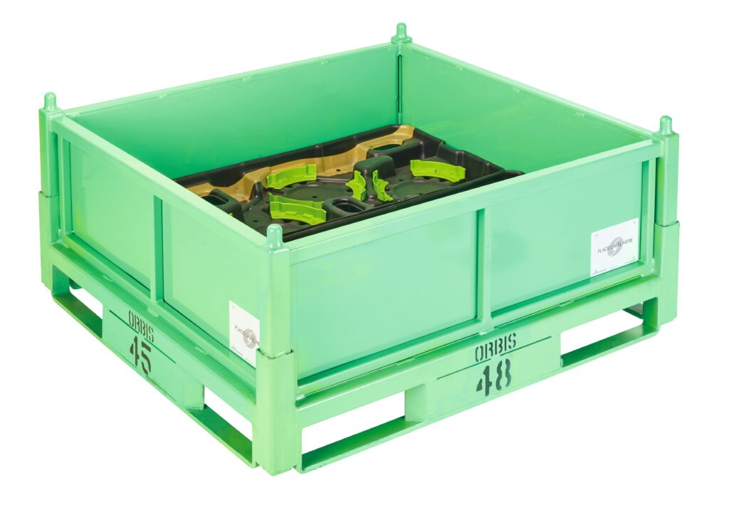 Green industrial plastic container with reinforced corners and a partially visible black and green object inside. The green framework appears to be sturdy and designed for heavy-duty use.